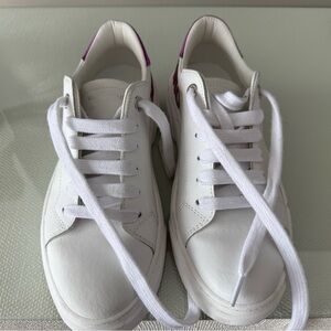 White Sneakers with Pink Logo.  Worn once as I bought the wrong size